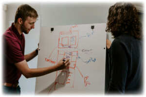 person-presenting-on-white-board-rigor-137
