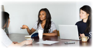 women-in-meeting-with-coffee-document-format-15
