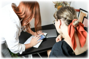 women-reviewing-notes-data-collection-131 